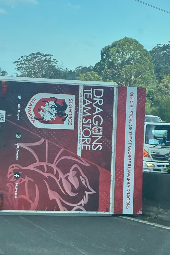The Dragons merchandise truck upturned on Mount Ousley on Friday afternoon.