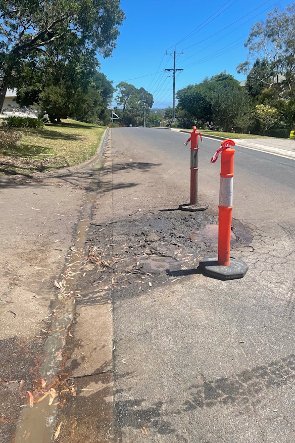 A McCrae street damaged by underground water before Tuesday’s landslide.