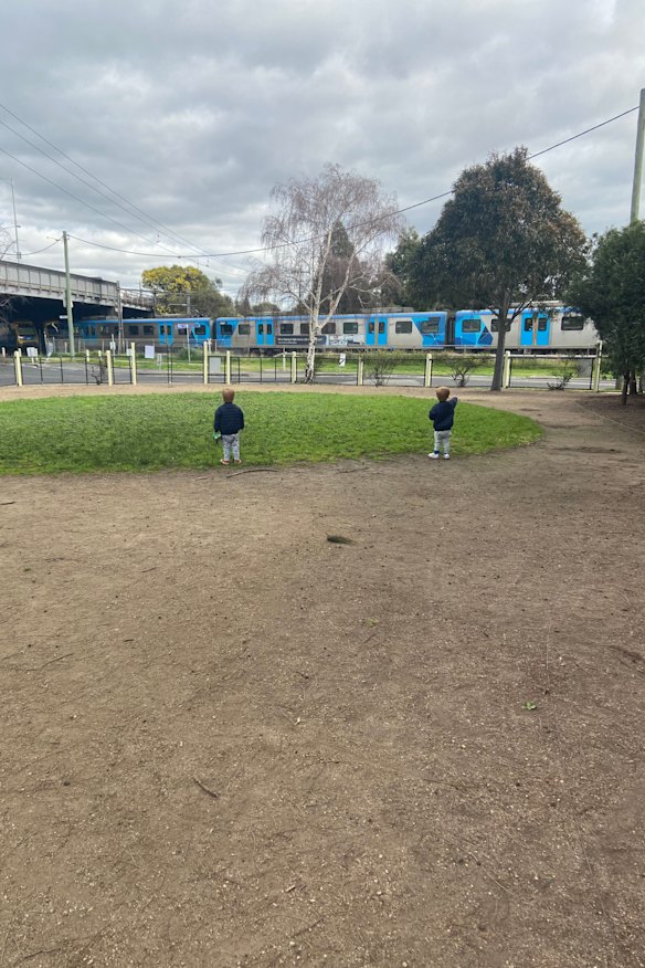At the park, the kids still loved seeing the passing trains and trucks.