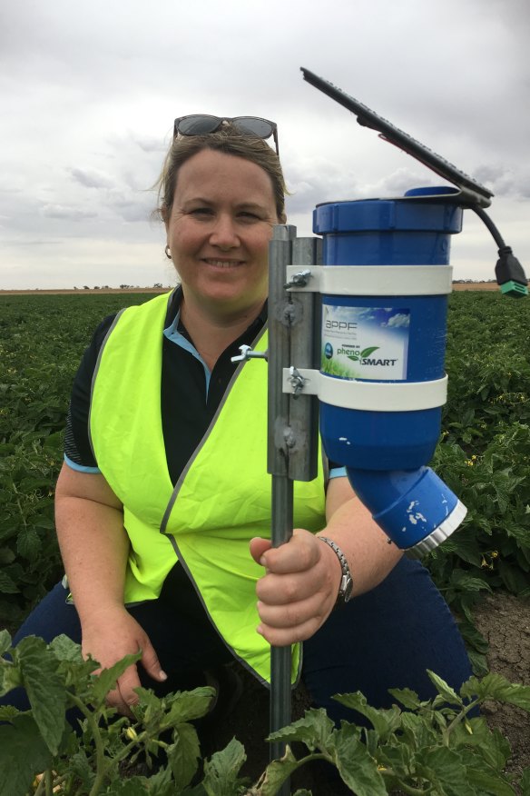 The CSIRO’s Dr Rose Roche with a WaterWise sensor. “This technology is a massive opportunity to help farmers save water,” she says.