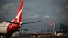A Qantas aircraft at Sydney Airport. The airline has now settled a claim against it for compensation relating to cancelled flights.