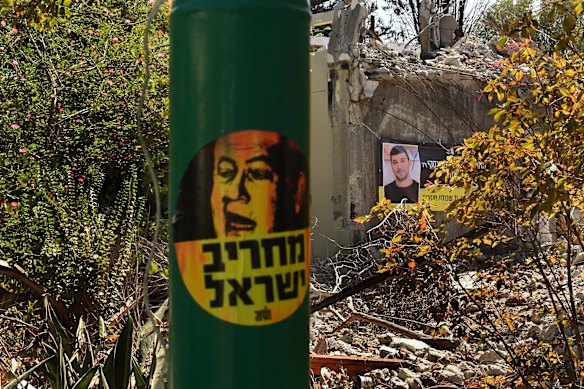 A sticker depicting Israeli Prime Minister Benjamin Netanyahu (left) with the words “Demolisher of Israel” in Kibbutz Be’eri where 101 civilians and 31 security personnel were killed by Hamas on October 7.