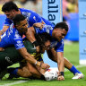 Tino Fa’asuamaleaui scores for the Kangaroos. 