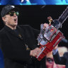 Elon Musk with the chainsaw he was given by Argentinian President Javier Milei at a recent conference in the US.