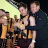 Dylan Moore is embraced by coach Sam Mitchell after overcoming a tumultuous period off the field to shine on it.
