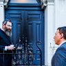 Rabbi Dovid Gurnick speaks to Dvir Abramovich outside the East Melbourne synagogue on Saturday.