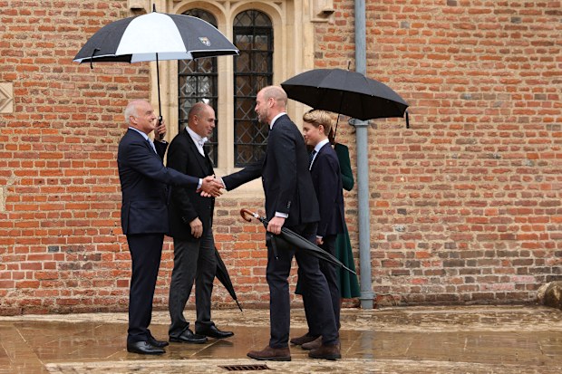 Prince William, Prince of Wales (front R), Catherine, Princess of Wales (behind R) and their 13-year-old son, Prince George of Wales (R), are met by headmaster Simon Henderson (2nd L) and provost Nicholas Coleridge (L) as Prince George arrives for his first day at Eton College on September 8, 2026 in Berkshire, England