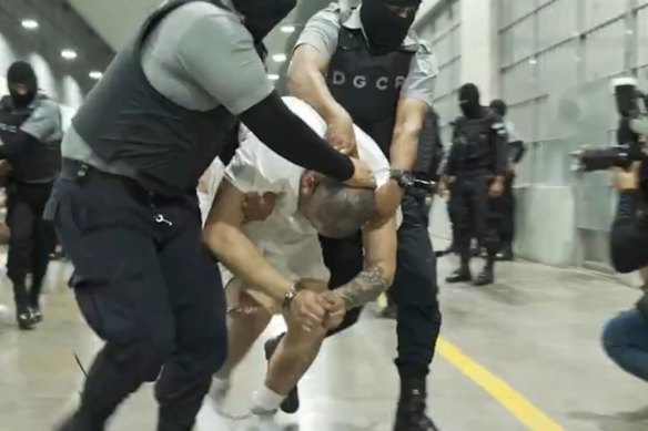 In a photo provided by the US District Court for Maryland, a man identified as Kilmar Abrego Garcia is led through the Terrorism Confinement Centre in Tecoluca, El Salvador.