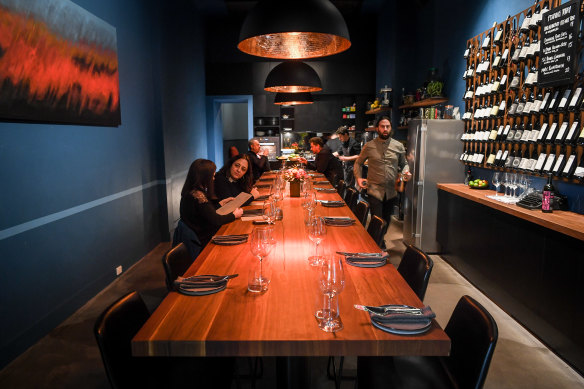 Diners at Pretty Little share one end of the same bench where chefs prepare their meal.