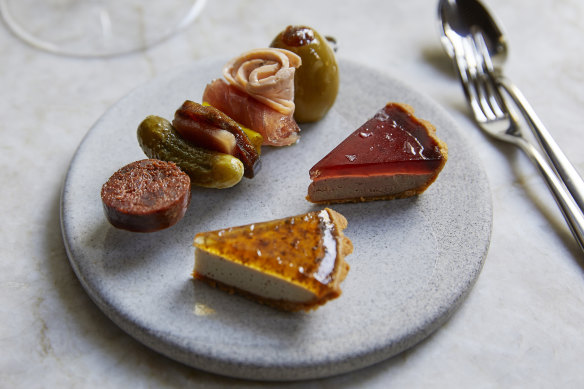 Fish Butchery charcuterie plate with a skewer of Murray cod chorizo, flathead mortadella and tuna ’nduja stuffed in an olive.