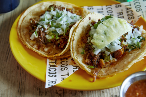 Chipotle barbacoa beef taco (left) and al pastor pork and pineapple taco at Ricos Tacos.