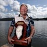Batemans Bay oyster farmer Bernie Connell with the corpse of Jill, his prized Pacific oyster.