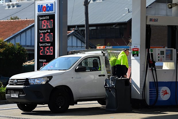 Customers fill their vehicles at the 7 Eleven Mobil petrol station on Liverpool Road in Ashfield, NSW.