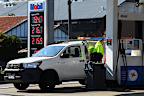 Customers fill their vehicles at the 7 Eleven Mobil petrol station on Liverpool Road in Ashfield, NSW. September 29, 2023.
