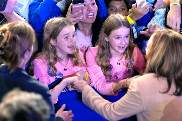 Democratic presidential nominee Vice President Kamala Harris, bottom right, greets young supporters after speaking during a campaign rally in Charlotte, USA.