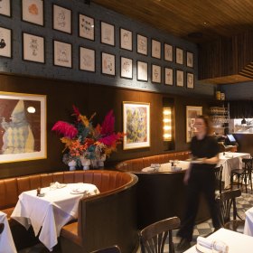 Staff prepare the dining room.