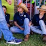 From left, Olivia, Olive and watch the cattle lawns prepare for the Royal Easter Show at Sydney Olympic Park on Wednesday. 