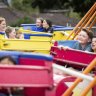 Kids enjoying a ride on the Whizzer at Our Lady’s School Fete in Ringwood.
