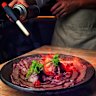 The ‘wagyu blanket’ dish, draped over mounds of seasoned rice, and topped with salmon roe cured in sake.
