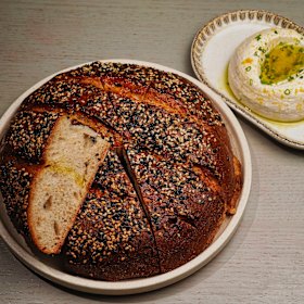 House-baked sesame sourdough with tarama and eggplant dip.