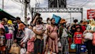 Cambodian migrant workers wait to cross back into Cambodia at a checkpoint  in Chanthaburi, Thailand. 