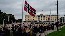 People wait in a line at the Palace Square in Oslo, Norway, Monday, Sept. 7, 2026, to parade past King Harald’s bier