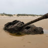 An abandoned American M18 army tank sitting in the sand at Ou Cuo Beach, in Kinmen.