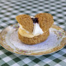 Butterfly profiterole with Davidson plum and cream.           