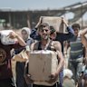 Israel accepts Gaza ceasefire plan, US says, as Hamas reviews draft