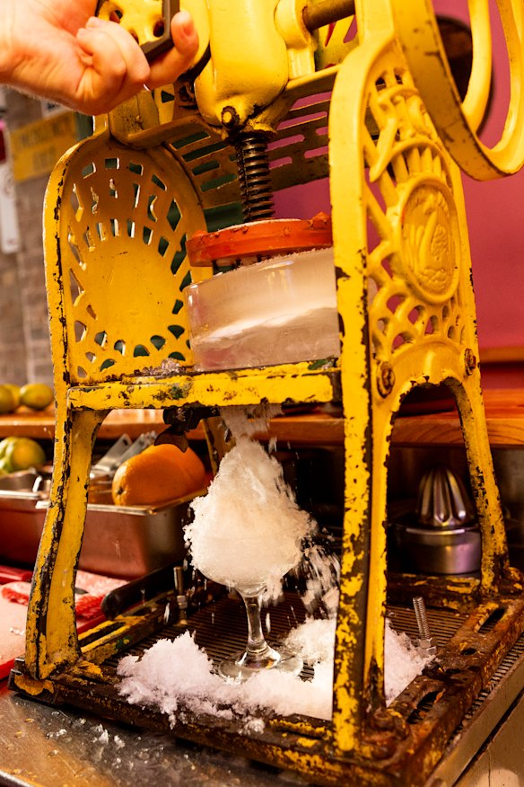 The margarita bar shaves down ice from giant blocks.