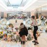 Shoppers pay tribute to victims as Westfield slowly returns to life