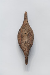 Installation view of a Murlapaka (shield) made by Kaurna people in the 19th century, Art Gallery of South Australia, Adelaide.