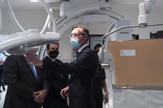 Mr Perrottet, Minister for Health Brad Hazzard and Minister for Western Sydney Stuart Ayres take a tour of the newly completed 14-storey clinical services building at the Nepean Hospital on Wednesday.