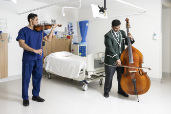 Sydney Year 11 student Daniel Koothoor, left, and Joshua Kovoor with their instruments at Westmead Private Hospital.