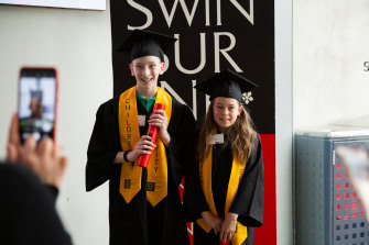Boronia K-12 students Matthew Payne (left) and Mikayla North graduate from the Children’s University program at Swinburne.