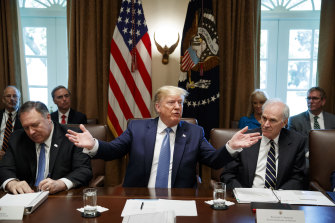 President Donald Trump, pictured with former Navy secretary Richard Spencer, right, and Secretary of State Mike Pompeo, left.