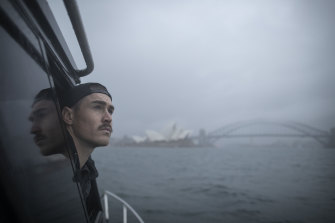 Greater Western Sydney star Jeremy Cameron drives his boat while out fishing on Sydney Harbour during lockdown last month. Right now, AFL players are banned from going fishing because of strict COVID-19 rules.