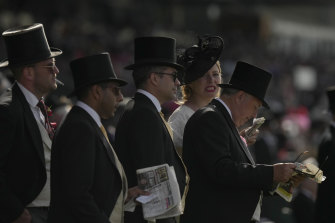 Traditional Royal Ascot racewear for gentlemen includes tie, wasitcoast and top hat. 