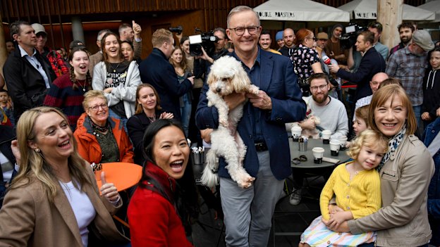 The morning after the election night before: Prime Minister Anthony Albanese with Toto and well-wishers at the Marrickville Library.