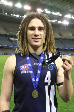 Gryan Miers with his Geelong Falcons TAC Cup premiership medallion in 2017.