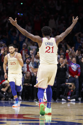 Embiid reacts to a Ben Simmons basket.