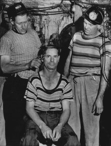 Jack Wiper cuts the hair of Tom Sharp, a mile underground at Bellbird. August 1, 1957