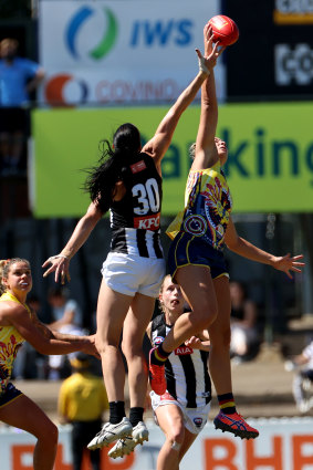 Alison Downie, left, and Caitlin Gould, right, compete for the ball. 