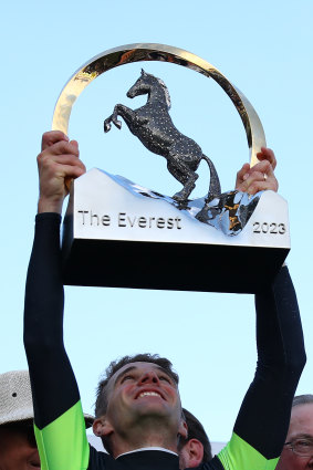 Sam Clipperton hoists The Everest trophy high.