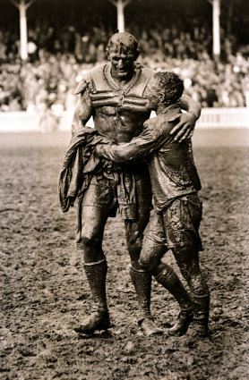 Norm Provan (St George) and Arthur Summons (Wests) leave a muddy SCG after the 1963 rugby league grand final. 
