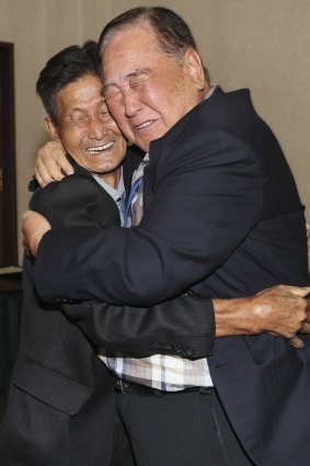 South Korean Ham Sung-chan, 93, right, hugs his North Korean brother Ham Dong Chan, 79.