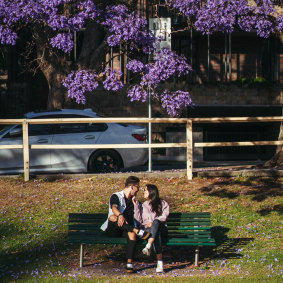 Carlos Fernandez and Angie Nino rest from a morning walk at McDougall Street, Kirribilli.