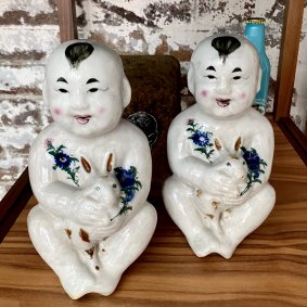 The two ceramic figurines from an “extremely odd” market in China that inspired the name White Rabbit and now sit in Judith Neilson’s private office.
