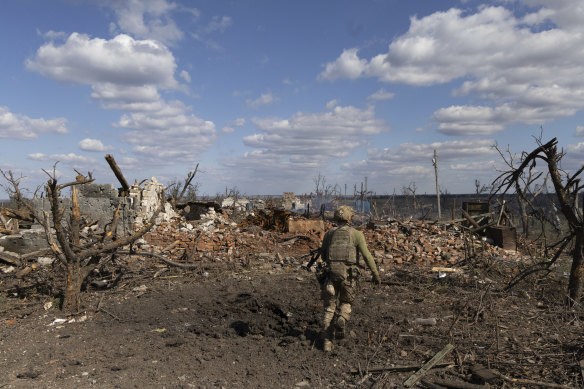 An assault unit commander from the 3rd Assault Brigade who goes by the call sign ‘Fedia’, runs to his position at the frontline in Andriivka, Donetsk region.