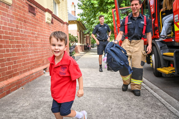Roy Valsorda is dropped off after a ride in a fire truck for his first day at Fairfield Primary School.